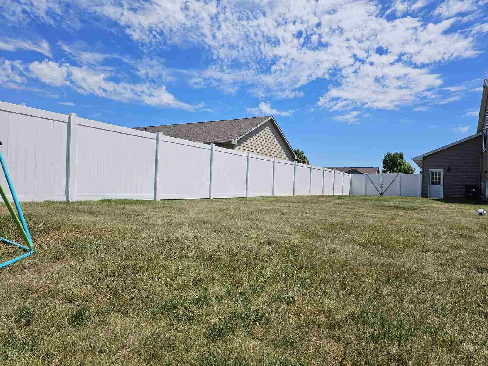White vinyl privacy fence, long backyard run