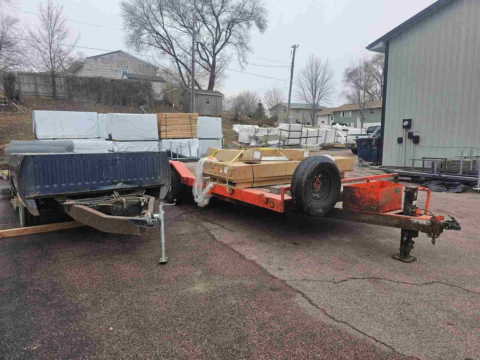 Nespor Fence pickup truck and trailer loaded with fence materials