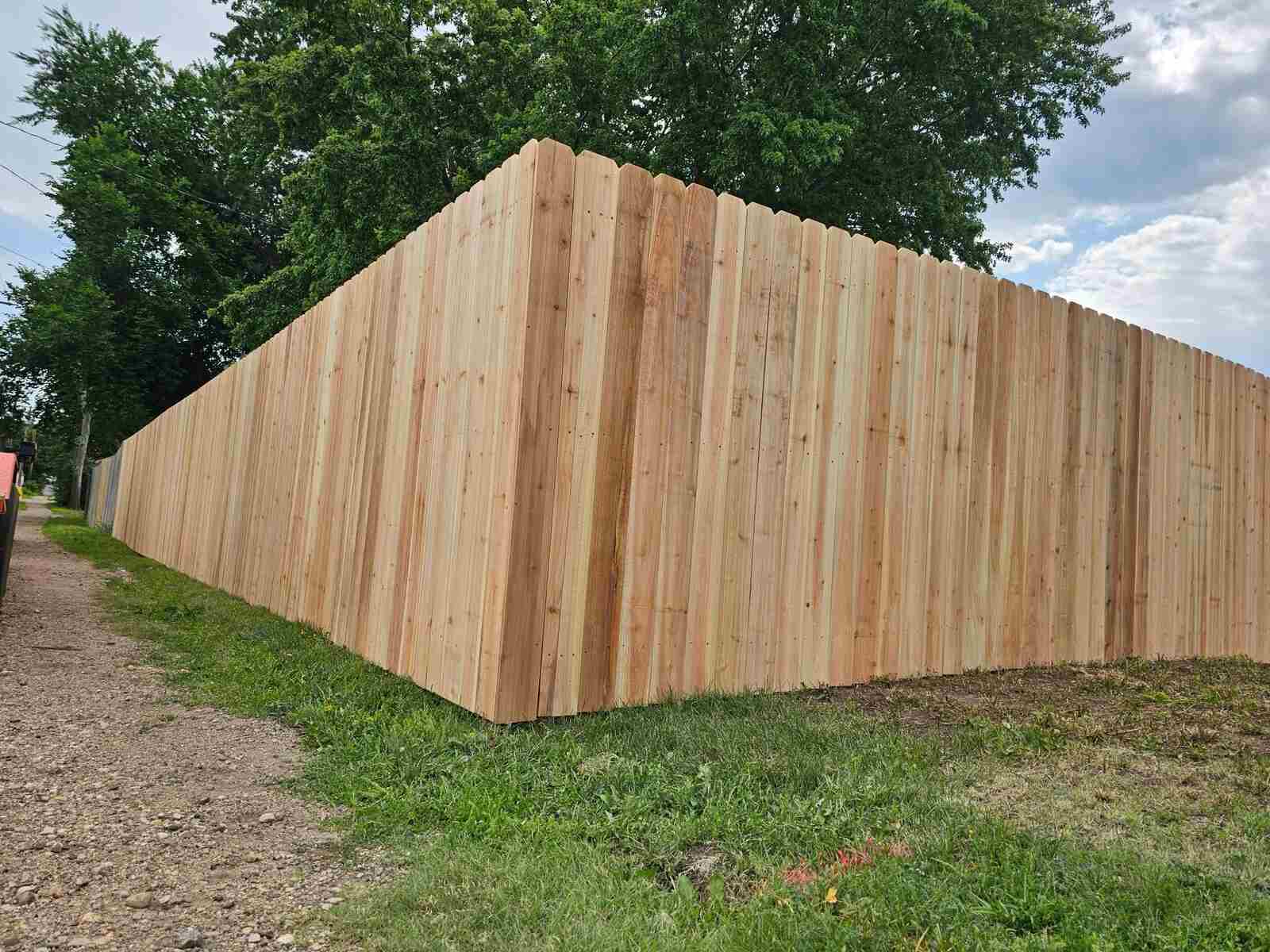 Cedar privacy fence corner, fresh unstained boards