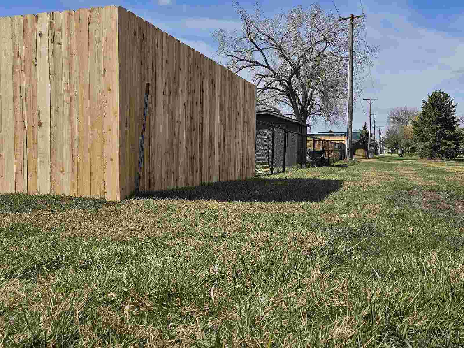 Cedar utility enclosure built as a screening structure