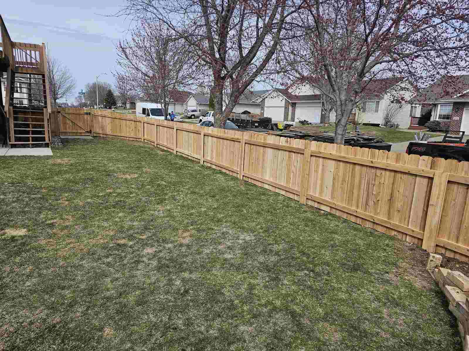Cedar privacy fence with a deck behind